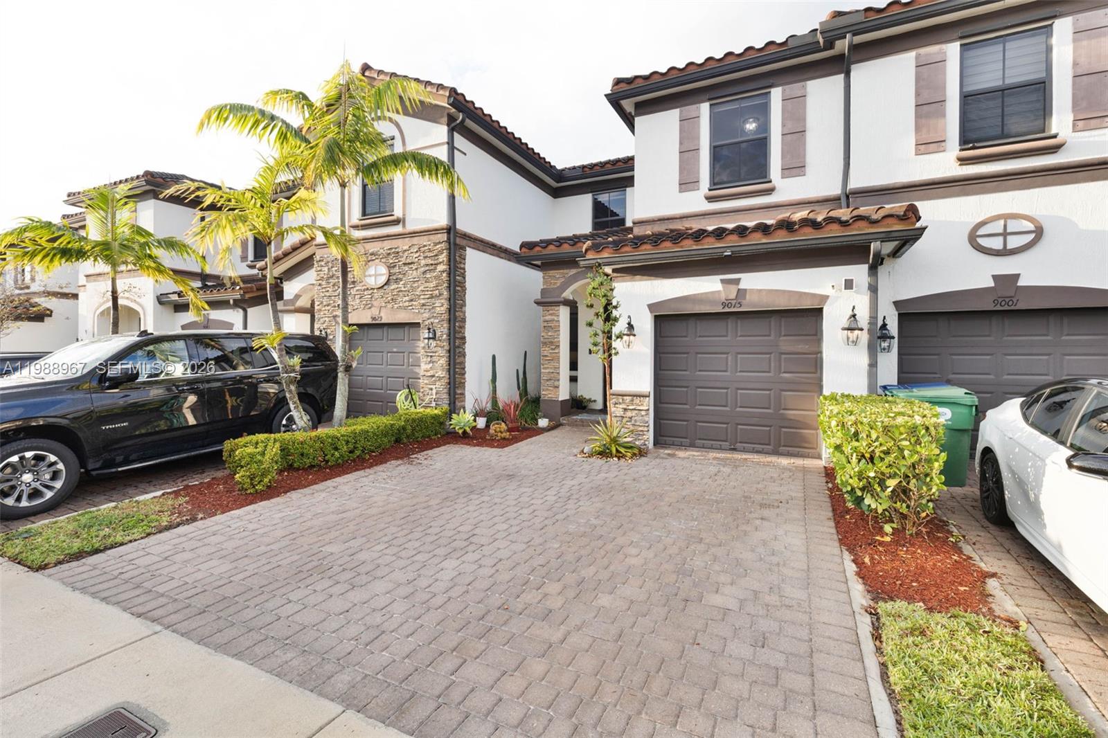 9015 Northwest 183rd Street Hialeah, FL 33018 - Photo 3 of 45 a view of a car park in front of a building