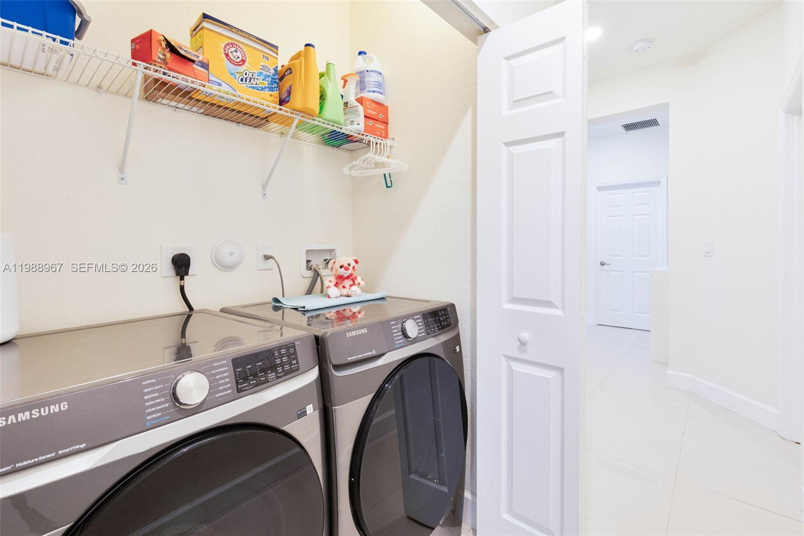 9015 Northwest 183rd Street Hialeah, FL 33018 - Photo 31 of 45 a utility room with dryer and washer