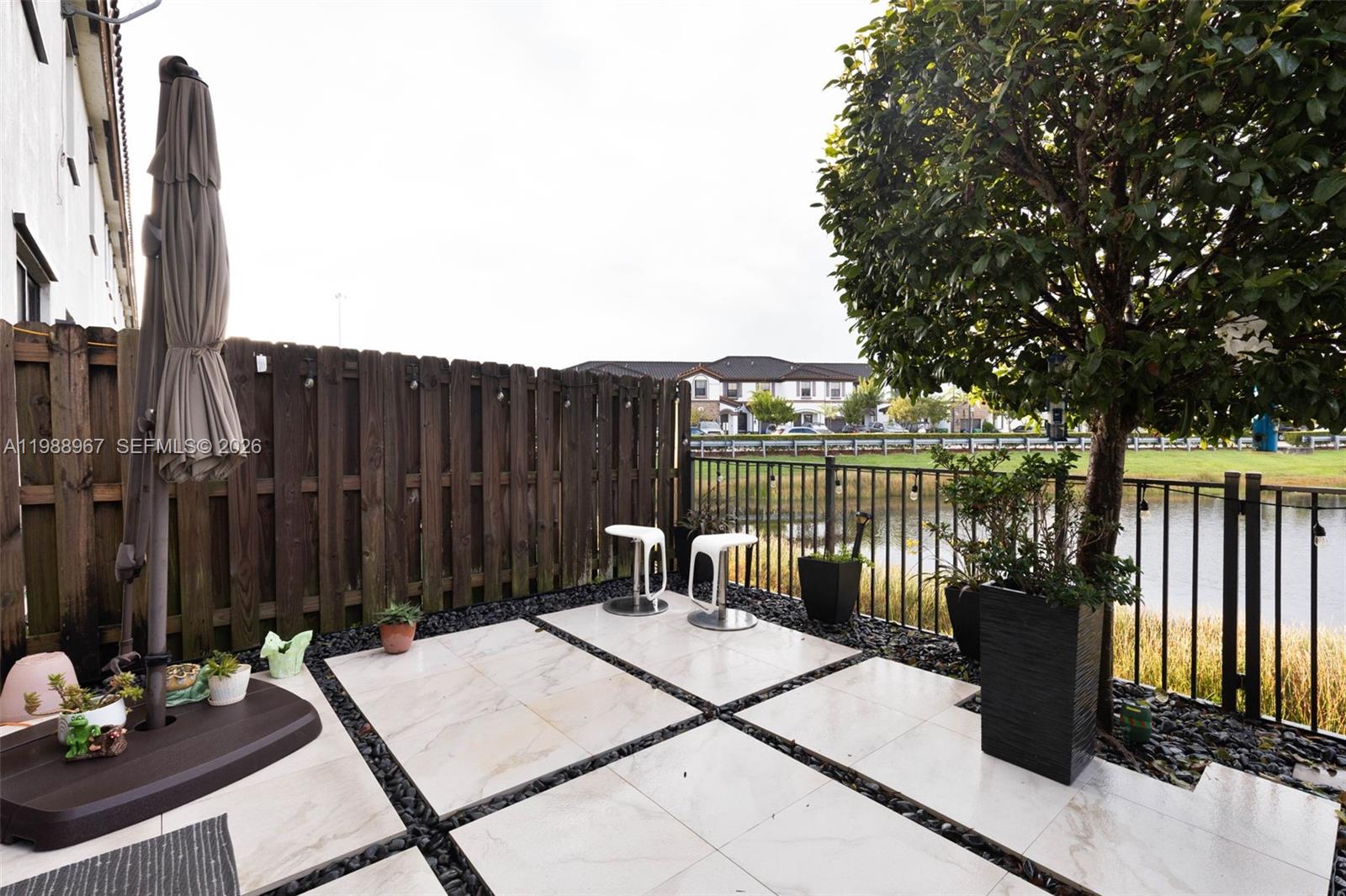 9015 Northwest 183rd Street Hialeah, FL 33018 - Photo 34 of 45 a view of a chairs and table on the terrace