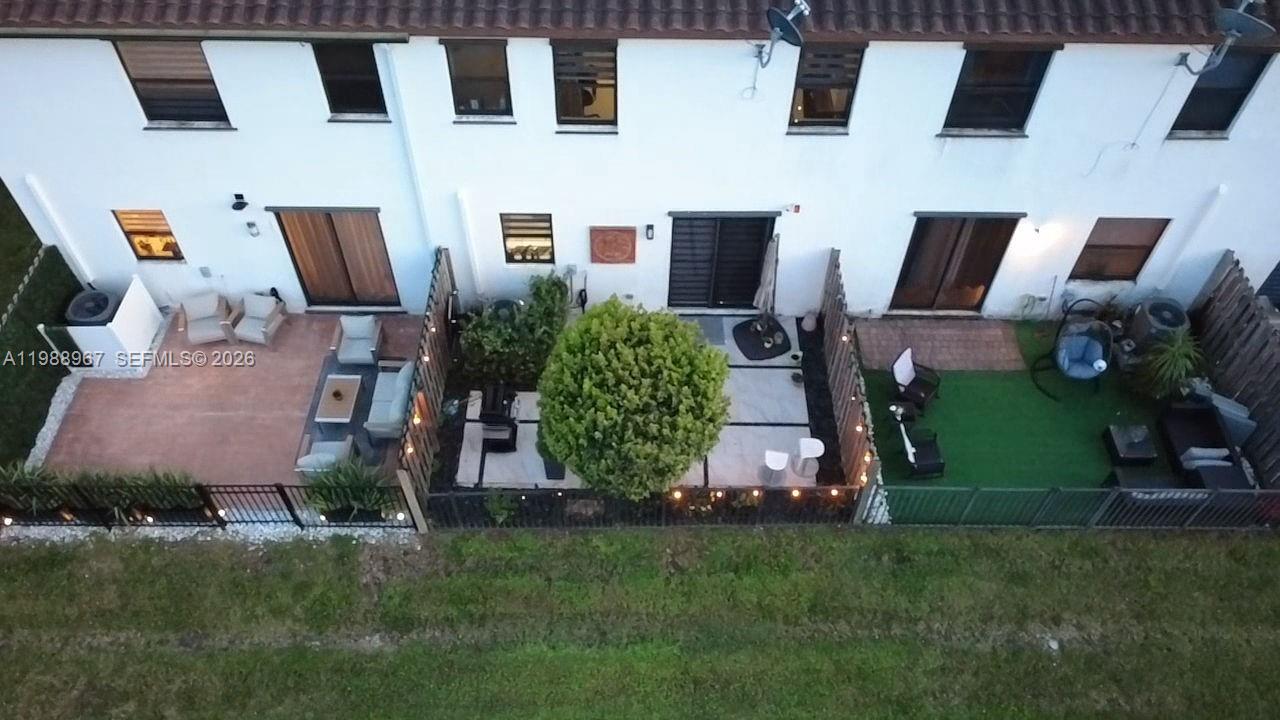 9015 Northwest 183rd Street Hialeah, FL 33018 - Photo 42 of 45 an aerial view of a house with garden space and street view