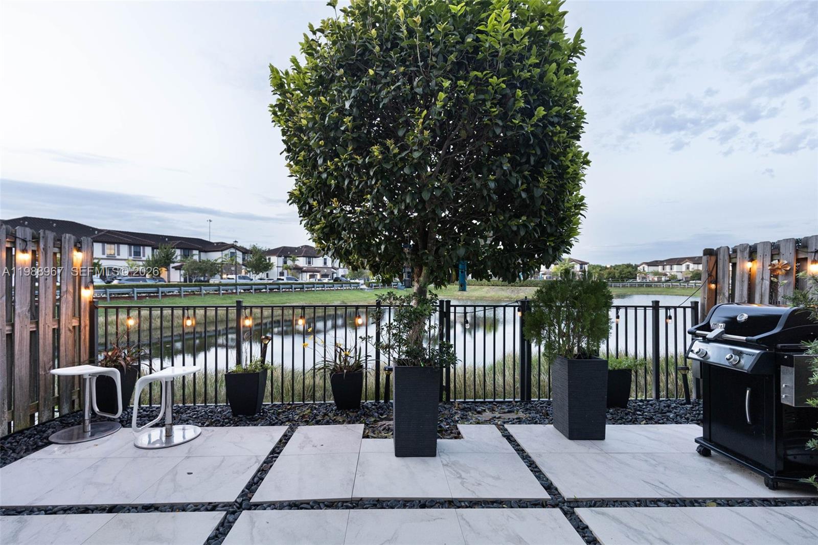 9015 Northwest 183rd Street Hialeah, FL 33018 - Photo 44 of 45 a view of a patio with a table and chairs