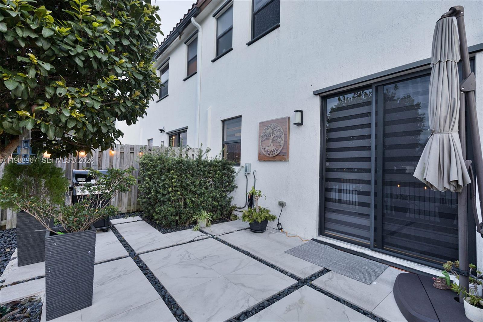9015 Northwest 183rd Street Hialeah, FL 33018 - Photo 45 of 45 a view of backyard path with potted plants
