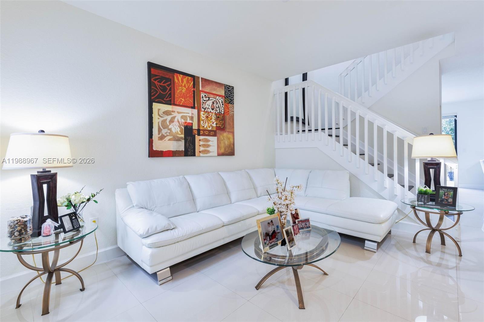 9015 Northwest 183rd Street Hialeah, FL 33018 - Photo 5 of 45 a living room with furniture and a potted plant