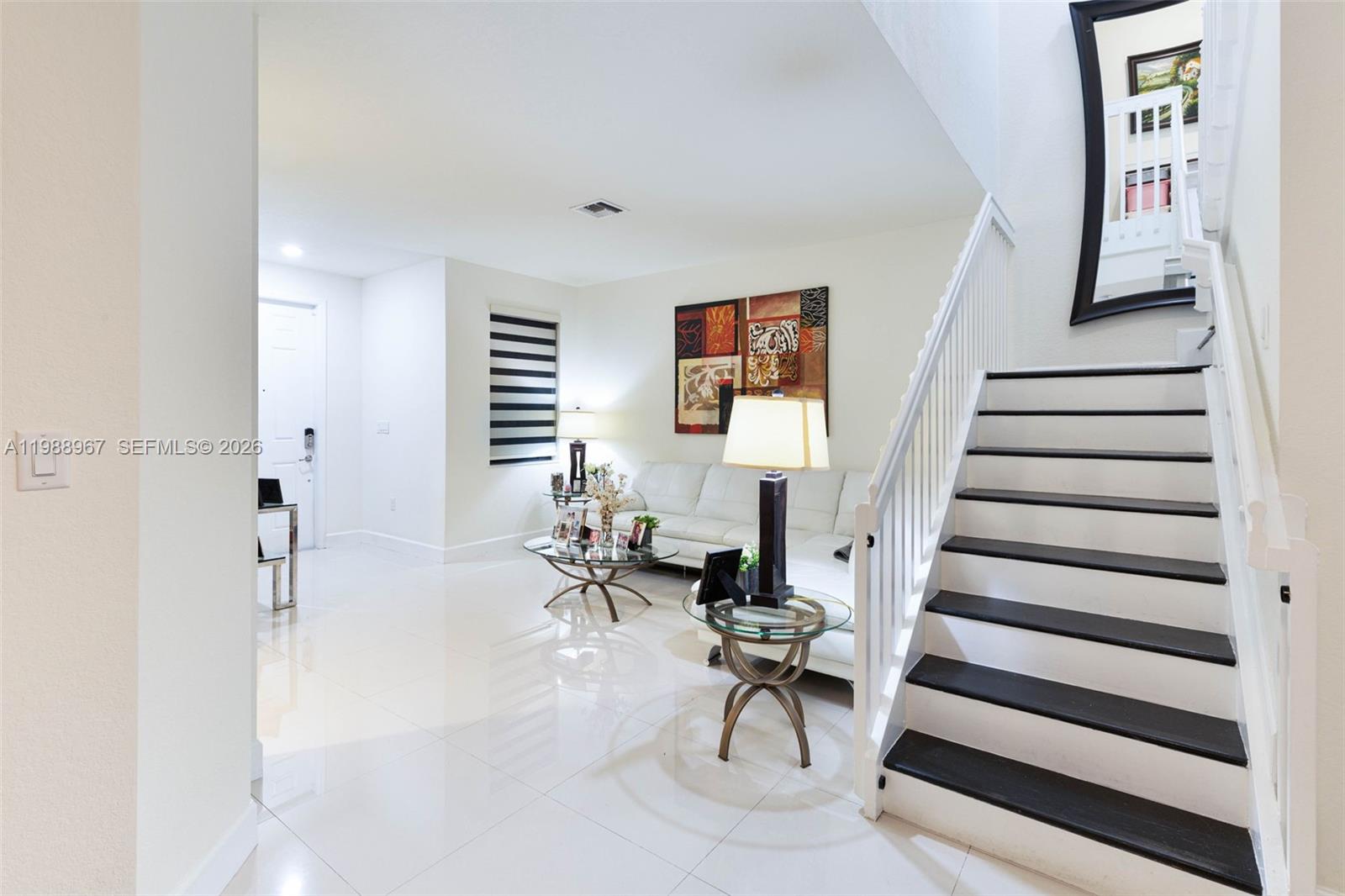 9015 Northwest 183rd Street Hialeah, FL 33018 - Photo 7 of 45 a living room with furniture and a table