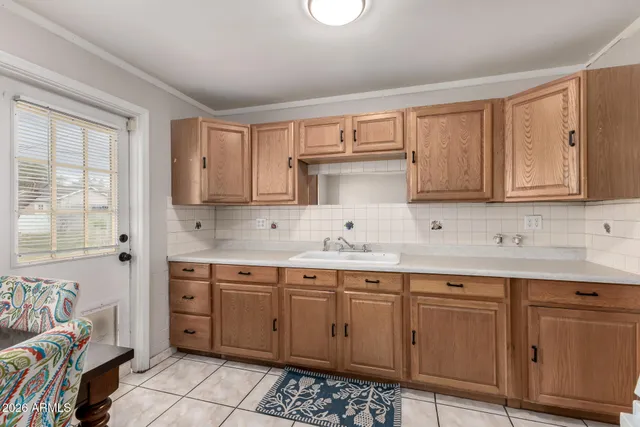 a kitchen with a sink and cabinets
