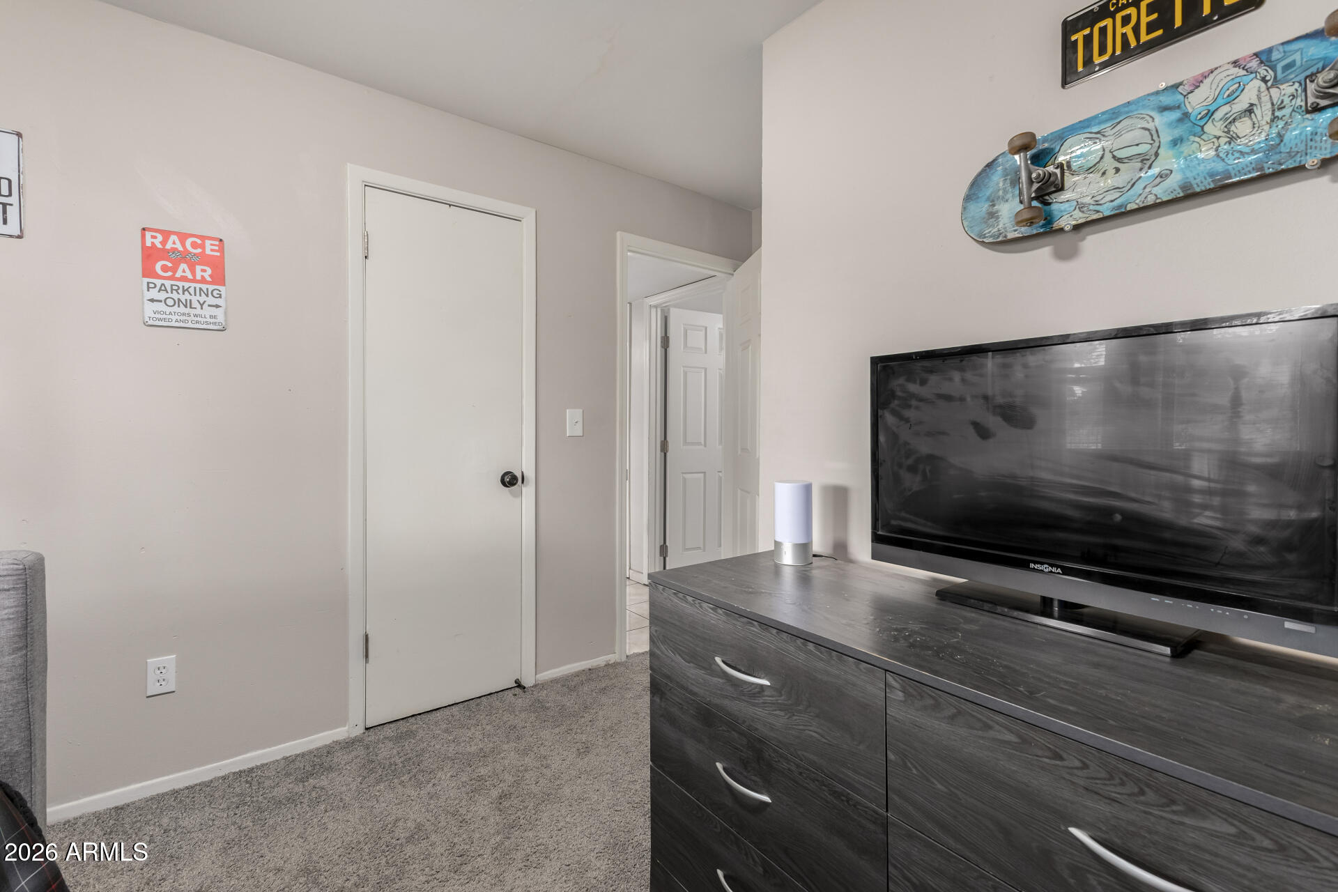4032 West Nancy Lane Phoenix, AZ 85041 - Photo 20 of 29 a living room with furniture and a flat screen tv