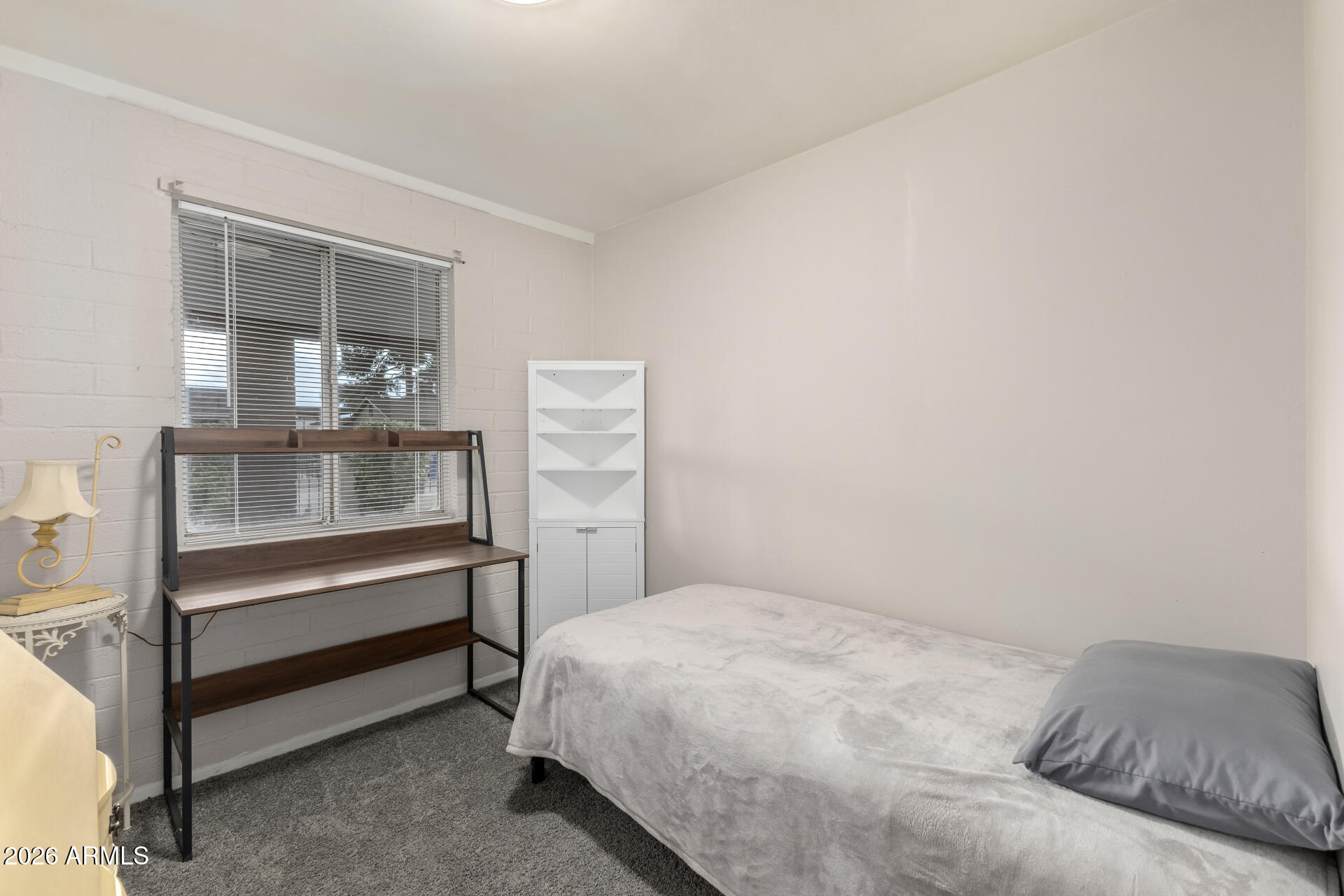 4032 West Nancy Lane Phoenix, AZ 85041 - Photo 21 of 29 a bedroom with a bed and a window