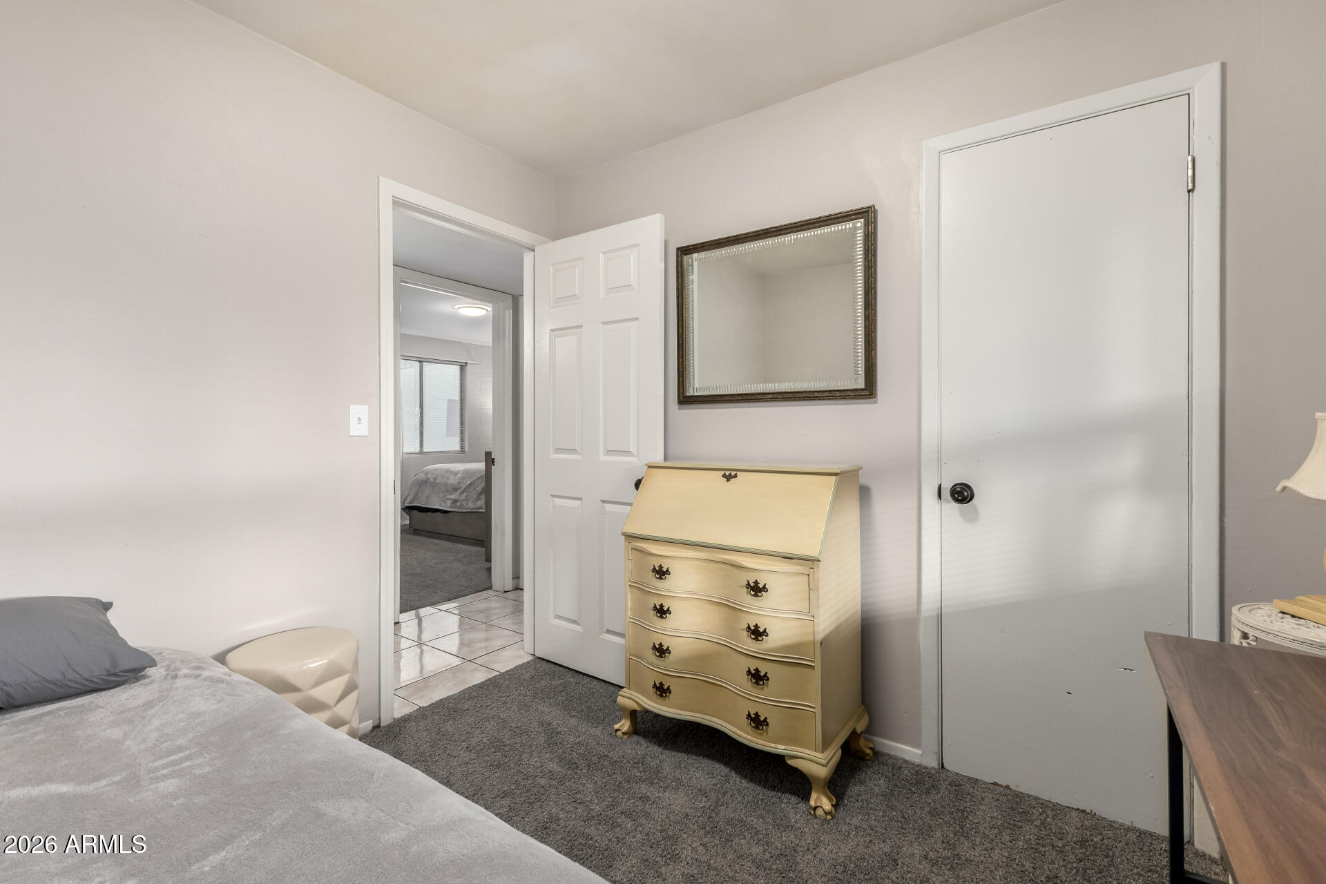 4032 West Nancy Lane Phoenix, AZ 85041 - Photo 22 of 29 a room with a mirror and a dresser