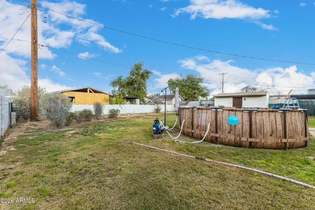 a view of outdoor space with wooden fence