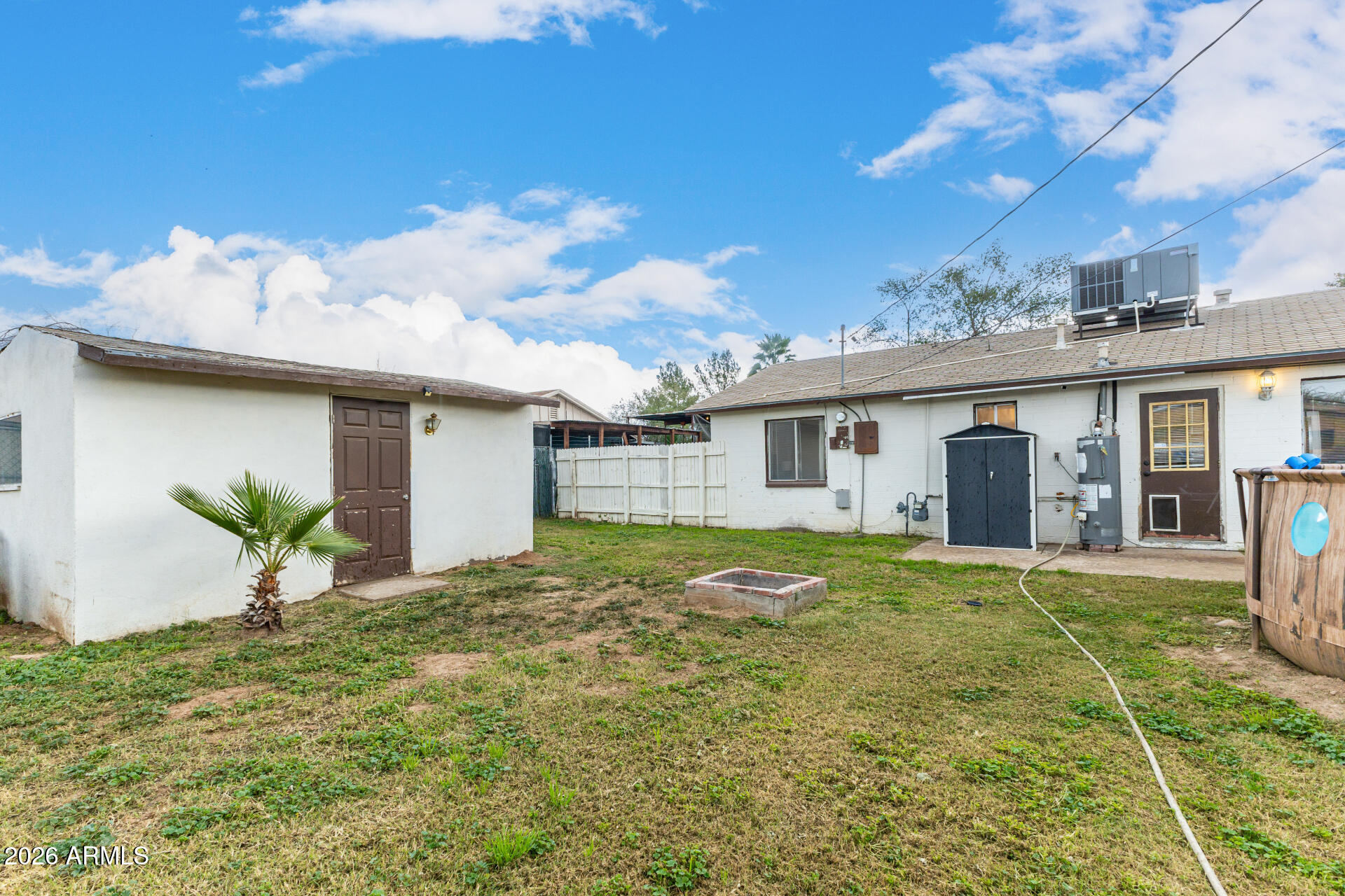 4032 West Nancy Lane Phoenix, AZ 85041 - Photo 27 of 29 a view of a house with a backyard