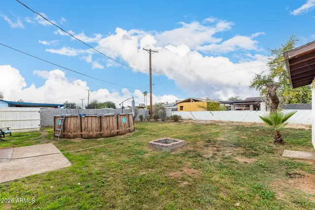 a view of a garden with a house