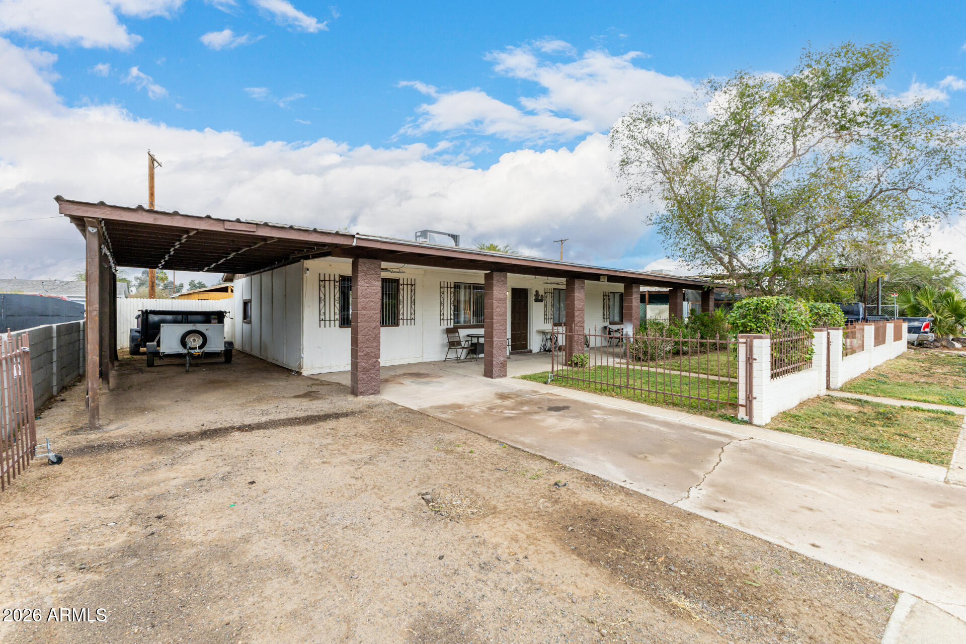 4032 West Nancy Lane Phoenix, AZ 85041 - Photo 3 of 29 a view of a house with a backyard