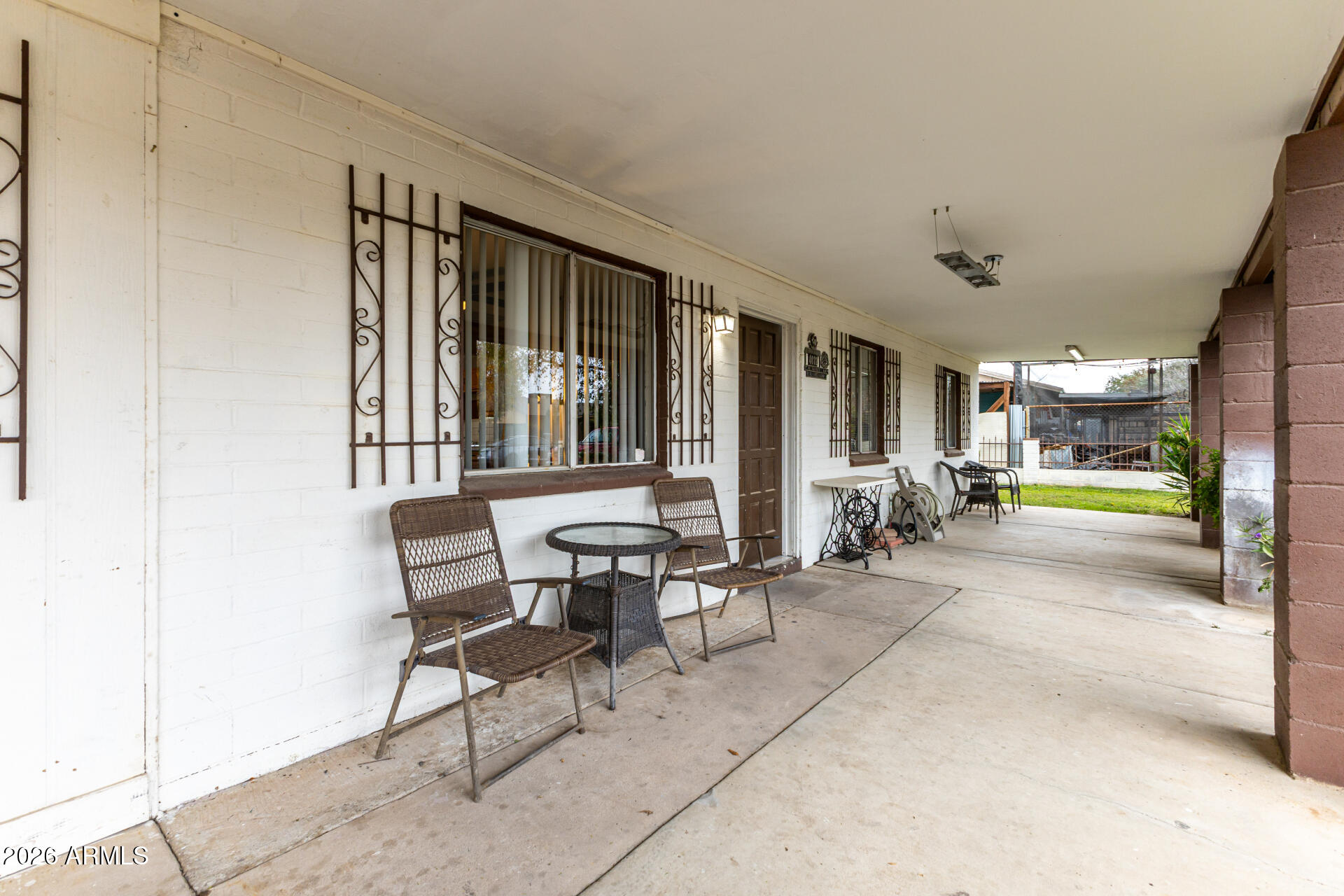 4032 West Nancy Lane Phoenix, AZ 85041 - Photo 6 of 29 a living room with furniture and a floor to ceiling window