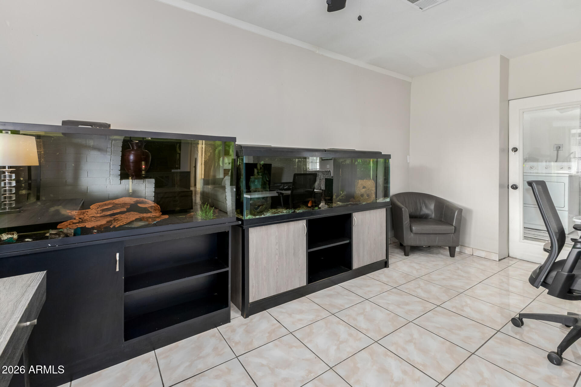 4032 West Nancy Lane Phoenix, AZ 85041 - Photo 10 of 29 a kitchen with stainless steel appliances kitchen island granite countertop a refrigerator and a sink