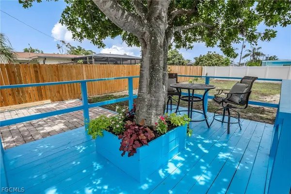 a view of a swimming pool with a patio and a garden