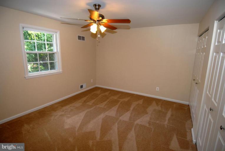 12801 Teaberry Road Silver Spring, MD 20906 - Photo 14 of 18 an empty room with a window