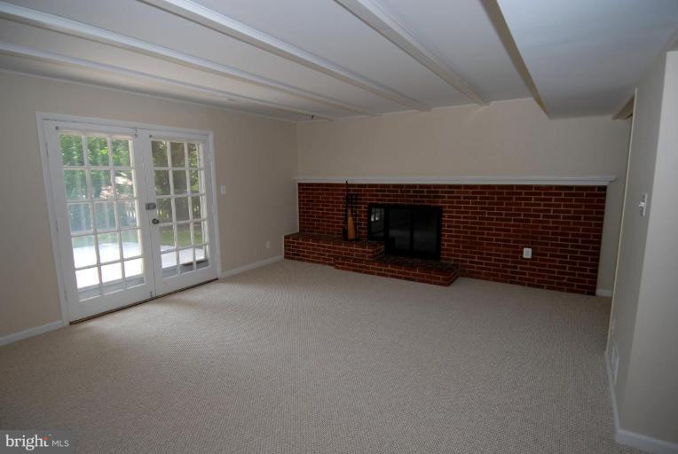 12801 Teaberry Road Silver Spring, MD 20906 - Photo 7 of 18 a view of empty room with a fireplace