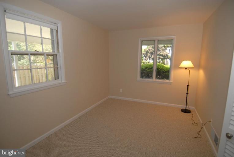 12801 Teaberry Road Silver Spring, MD 20906 - Photo 9 of 18 an empty room with windows