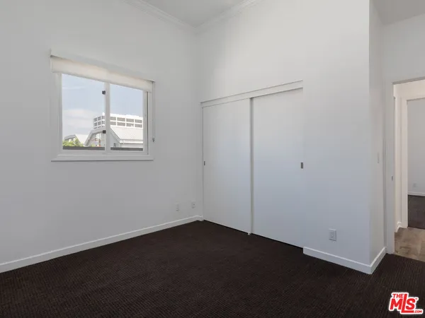 a bathroom with a toilet a sink and a mirror