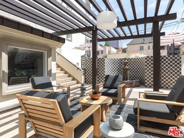 a view of a swimming pool with sitting area