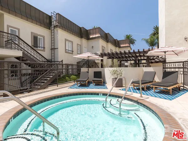 a view of a building next to a yard