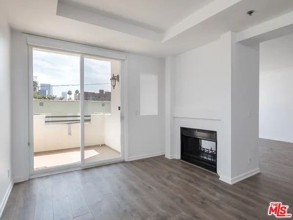 a kitchen with kitchen island a white stove top oven and sink