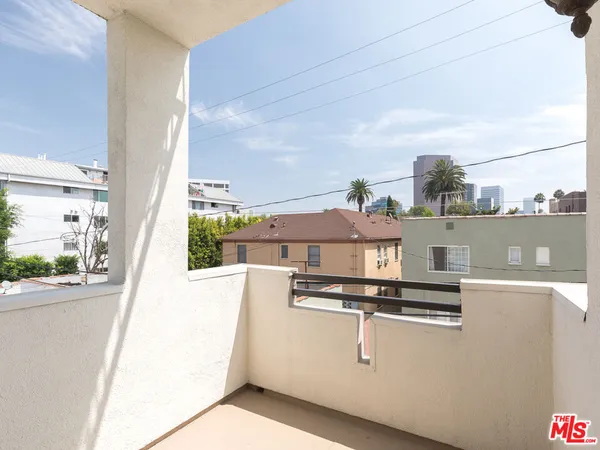 a view of a kitchen with a sink and a stove top oven
