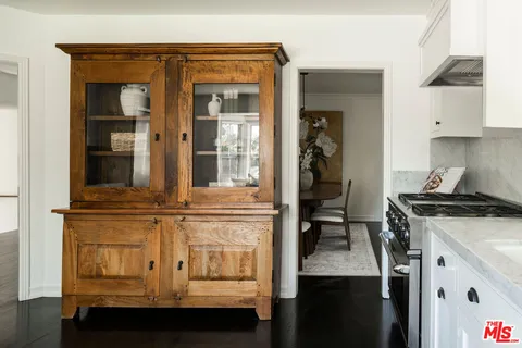 a kitchen with stainless steel appliances granite countertop a stove and a refrigerator