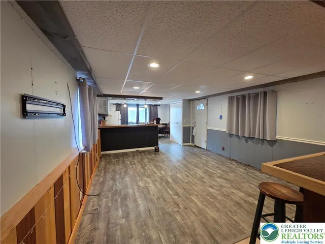 a kitchen with stainless steel appliances granite countertop a sink a stove counter space and cabinets