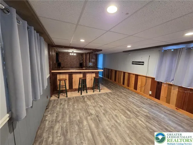 a kitchen with stainless steel appliances granite countertop a refrigerator a stove and a sink