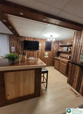 a kitchen with refrigerator and cabinets