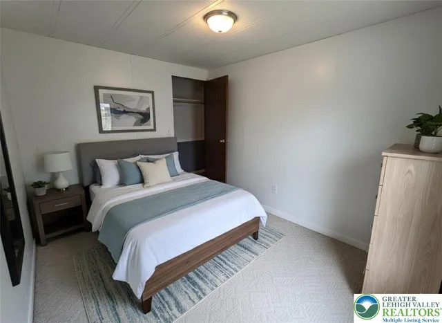 a spacious bathroom with a shower sink and mirror