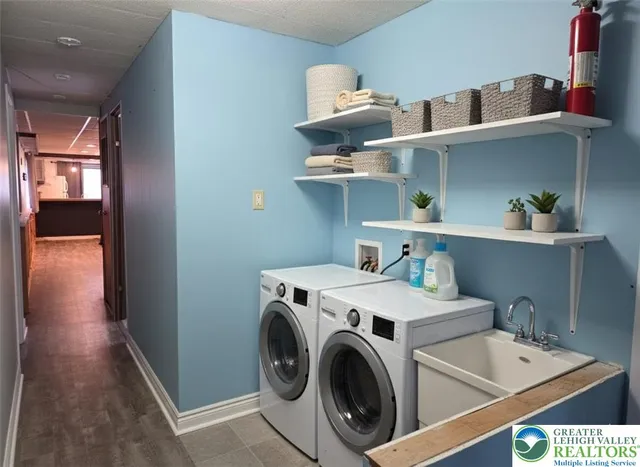 a view of a patio with table and chairs with wooden floor and fence