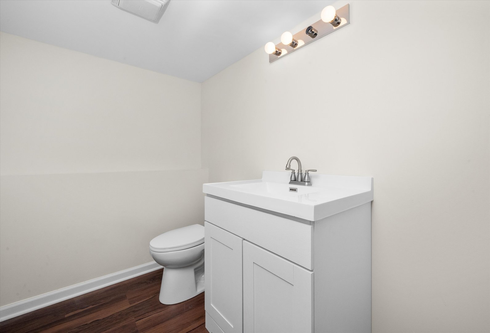 18057 Juneway Court Country Club Hills, IL 60478 - Photo 27 of 36 a bathroom with a sink a toilet and a mirror