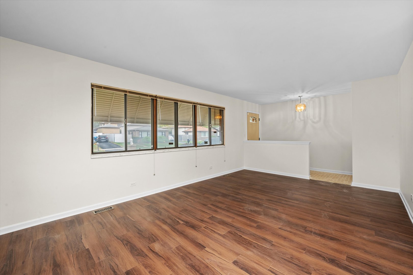 18057 Juneway Court Country Club Hills, IL 60478 - Photo 10 of 36 wooden floor in an empty room with a window