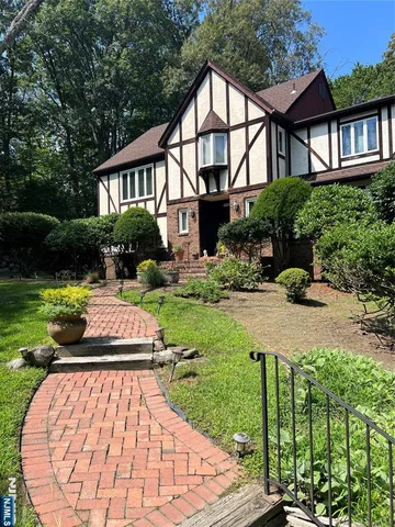 a front view of a house with a yard table and chairs