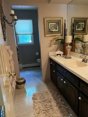 a bathroom with a sink double vanity and a mirror