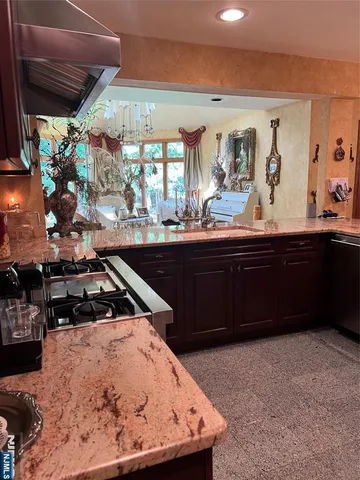 a kitchen with a sink and wooden cabinets