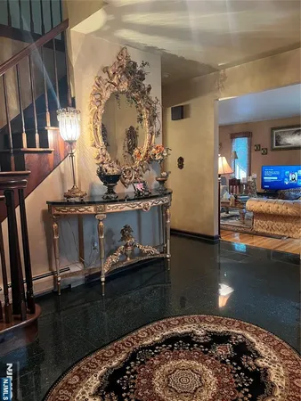 a living room with hard wood flooring