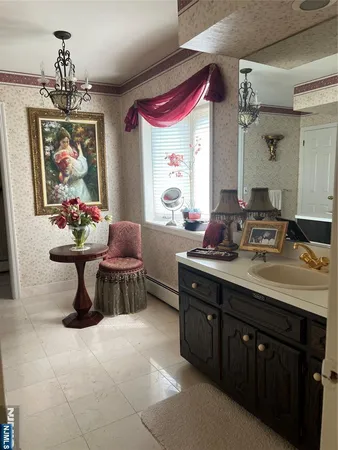a kitchen with a stove a sink and dishwasher with wooden cabinets