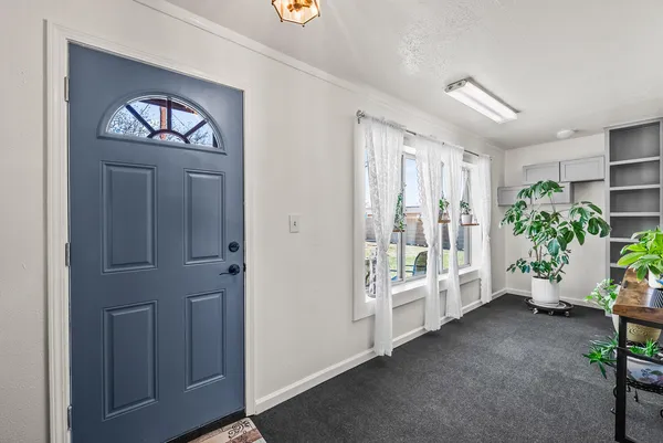 a view of an entryway with front door