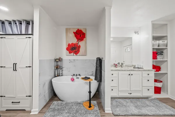 a room with a sink and a mirror