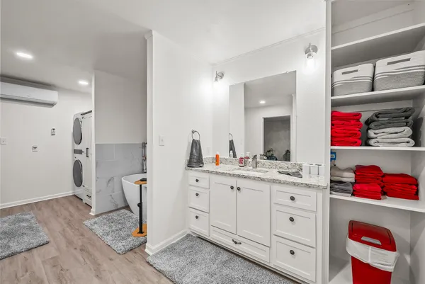 a view of room with wooden floor and closet