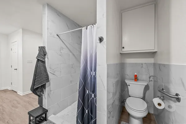 a bathroom with a bathtub and a shower