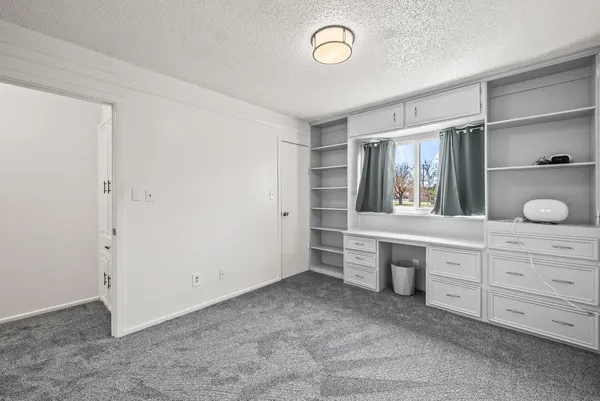 a view of cabinets and window