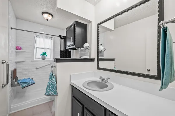 a bathroom with a sink and a mirror