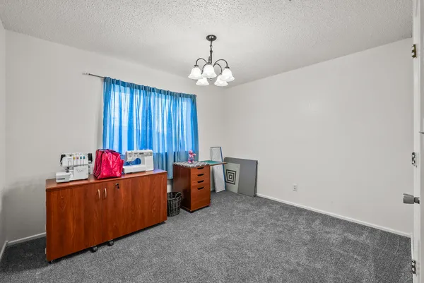 a view of a room with toys and a chandelier