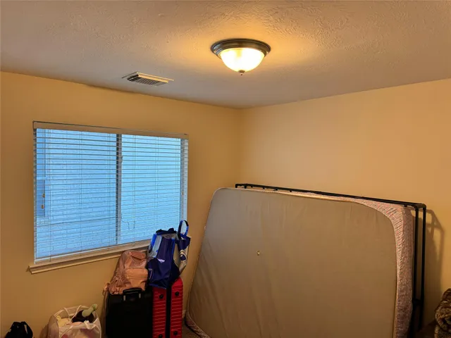 a living room with couch and a table