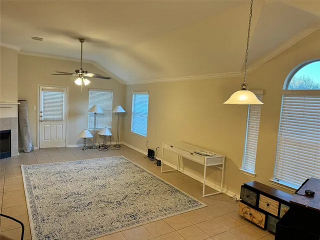 a white toilet sitting next to a white wall