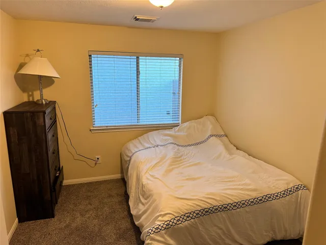 a bedroom with a bed and a closet